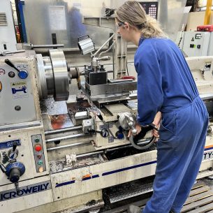Samara turning a pin in 4 jaw chuck